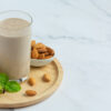 Banana almond smoothie on marble background